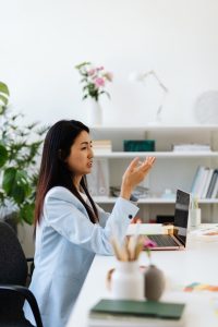 Professional woman analyzing business data and discussing the importance of functional analysis in determining arm’s length pricing for transfer pricing compliance