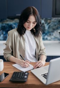 Businessman analyzing financial documents on a desk, representing the selection of appropriate transfer pricing methodology for compliance and accuracy